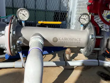Injector installed between flanges at a fenced pump station